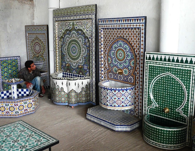 Brightly coloured mosaic wall fountains